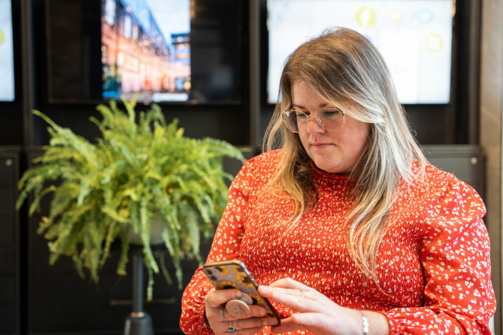 Libro Owner on her phone in a Libro branch
