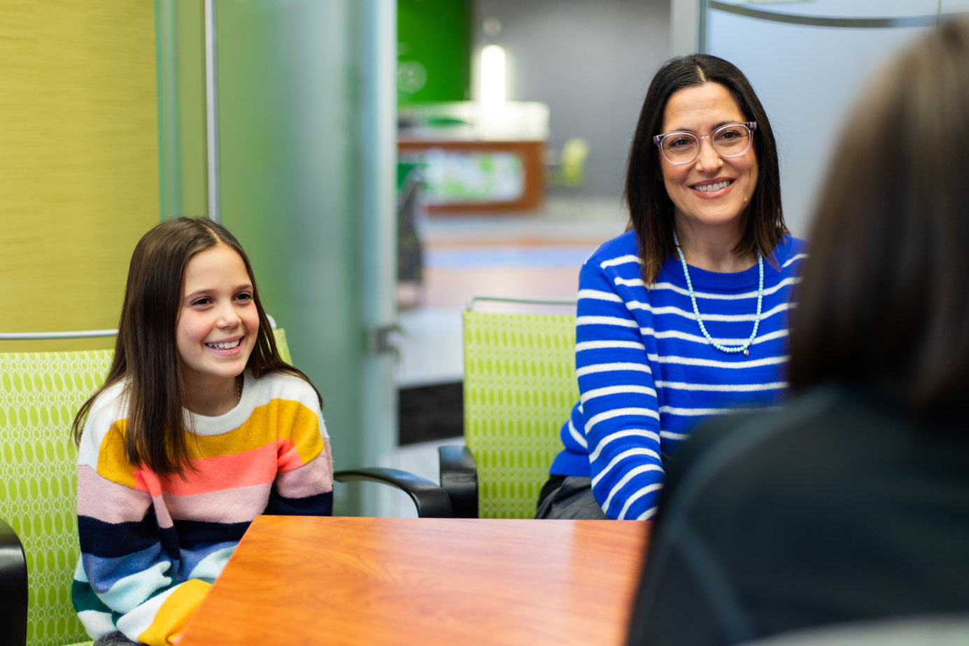 Libro Owner and her child talking with a Libro Coach