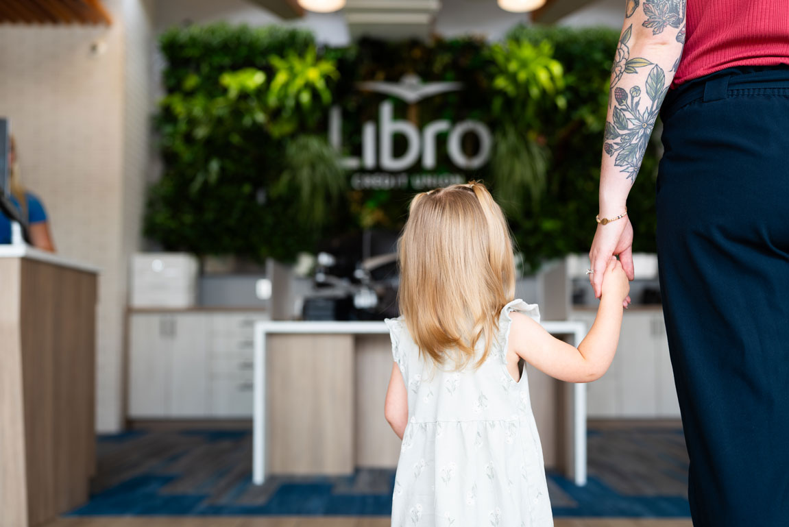 Young girl walking into a Libro branch