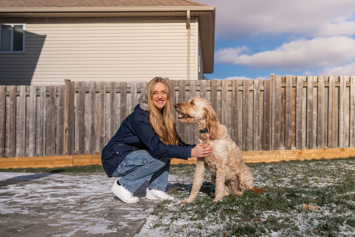Teen with a dog outside