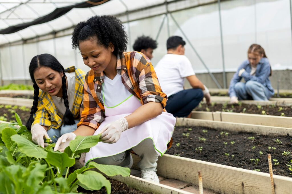 Image of students in a greenhouse learning about plants