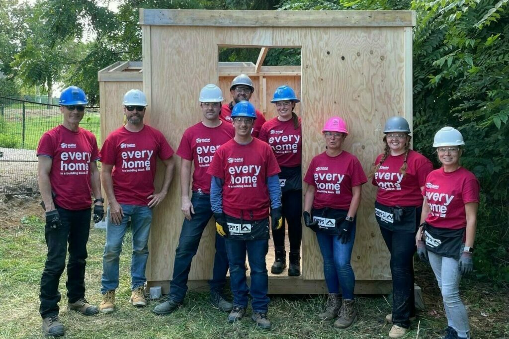 A group photo of Libro employees participating in a Habitat for Humanity build