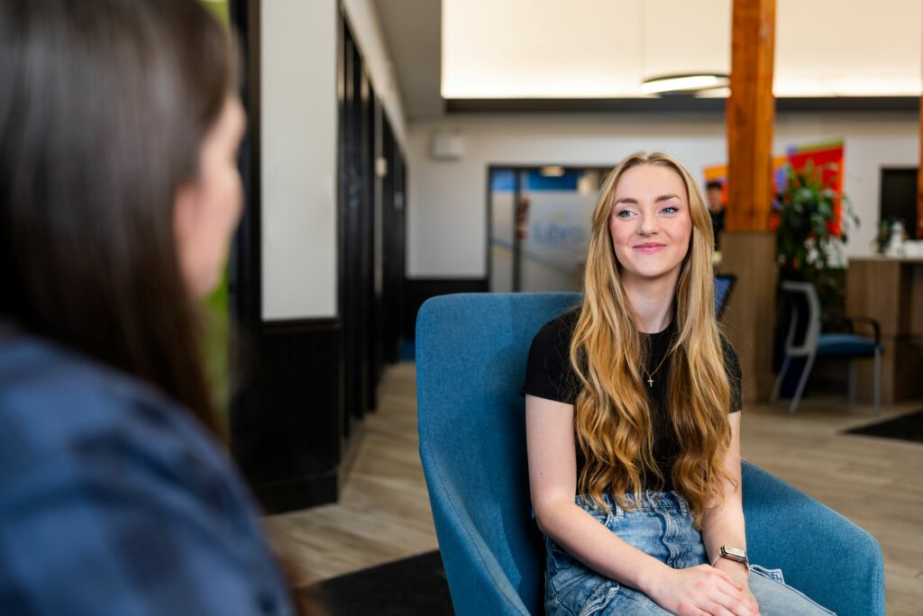 Student talking to a Libro Coach in a Libro branch