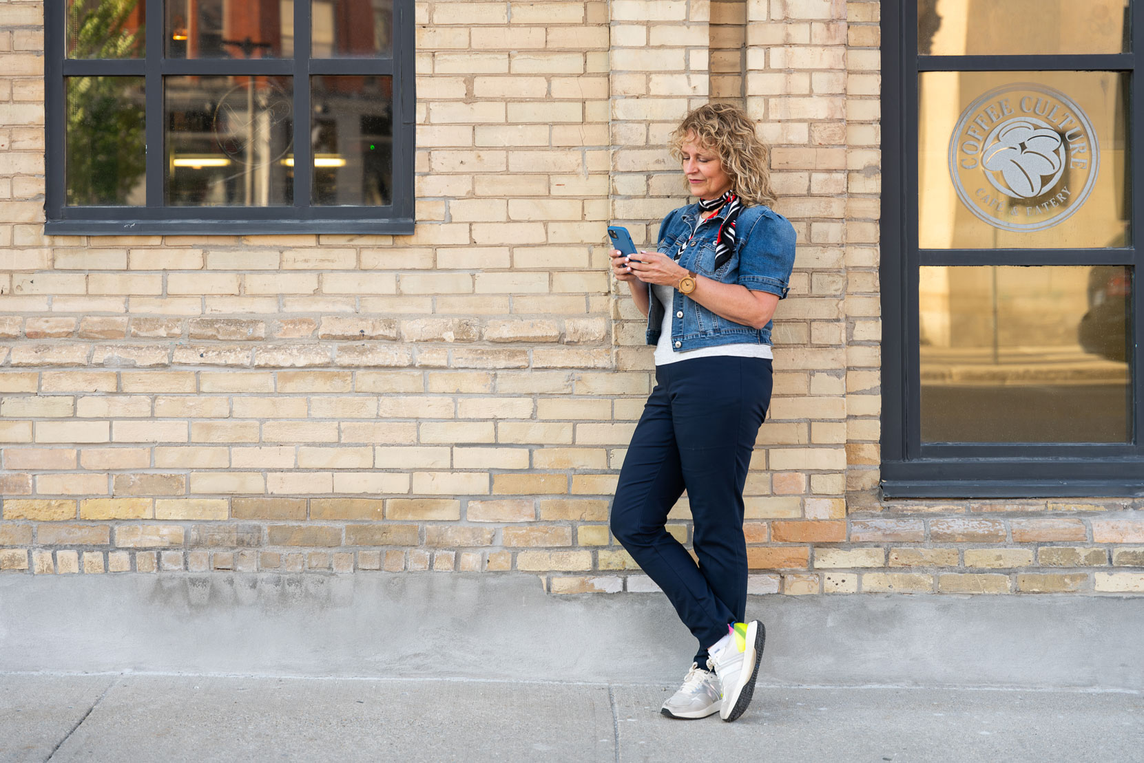 Libro Owner looking at her phone