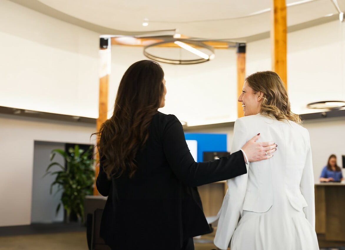 Libro Owner Lisa and Libro Coach Rebecca walking in a branch